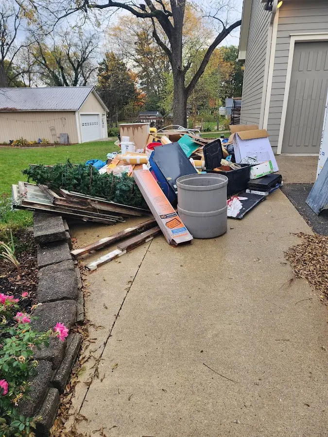 Dumpster being loaded with debris for Demolition Dumpster Rental in Maple Heights-Lake Desire